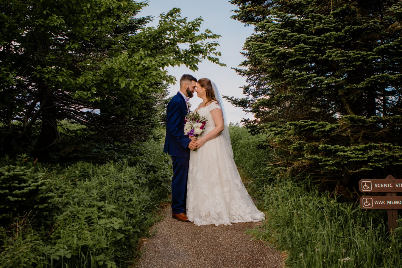 A wedding couple nuzzling noses in the trees New Haven CT wedding photographer